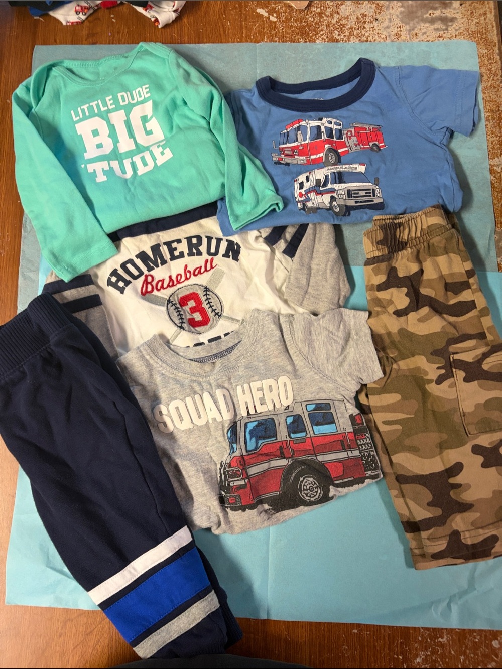 9mth lot. 2 pants. 1 long sleeve onesie never worn. 2 t shirt and 1 long sleeve
